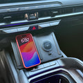Faro-Dock Dual Station wireless charger installed in a 2027 Kia Telluride center console, charging a phone
